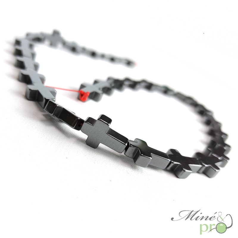 Hématite en perles plates "croix" 14mm - fil complet